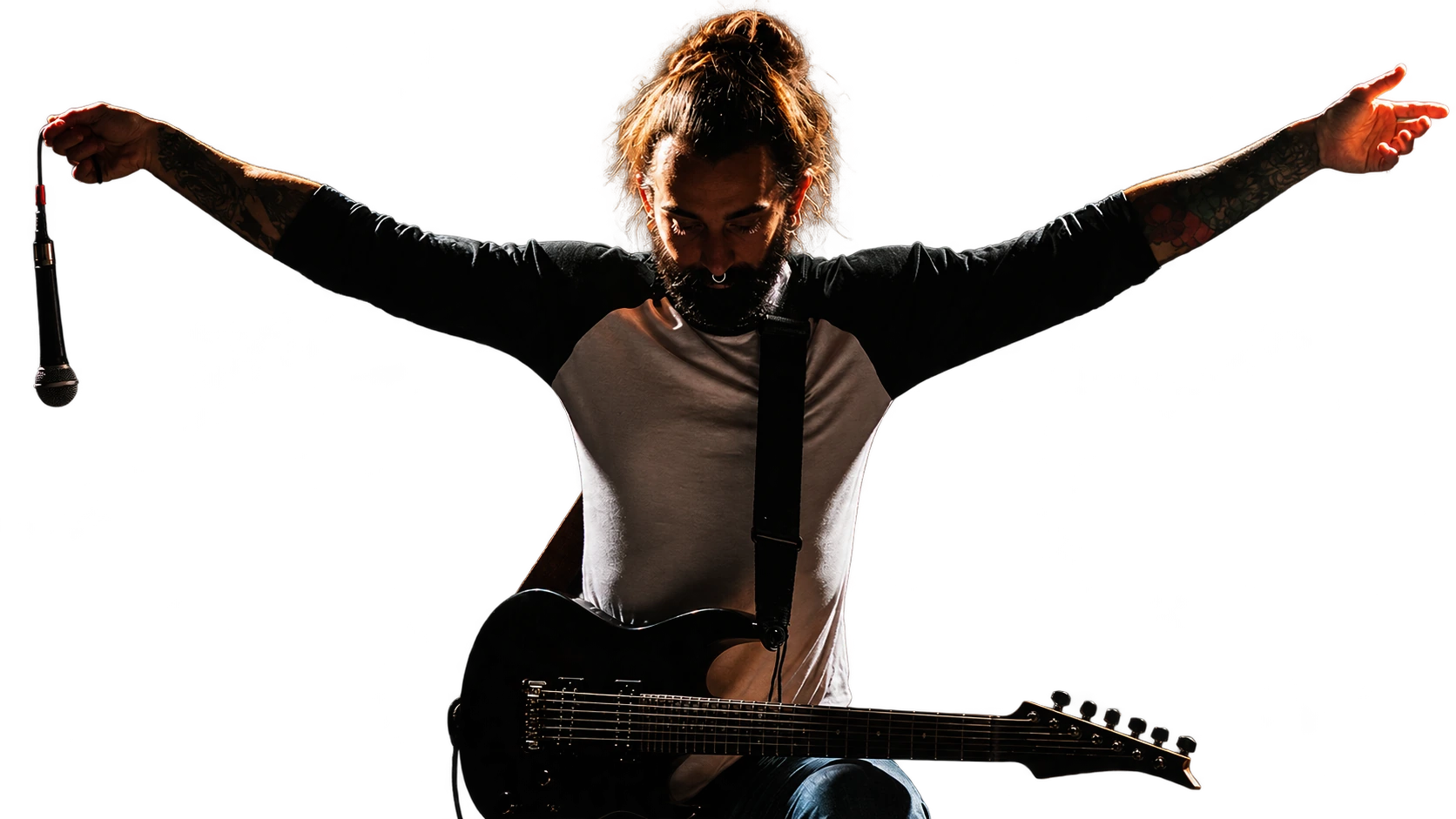 ELSE frontman on stage, arms outstretched, holding a microphone with a guitar on his lap